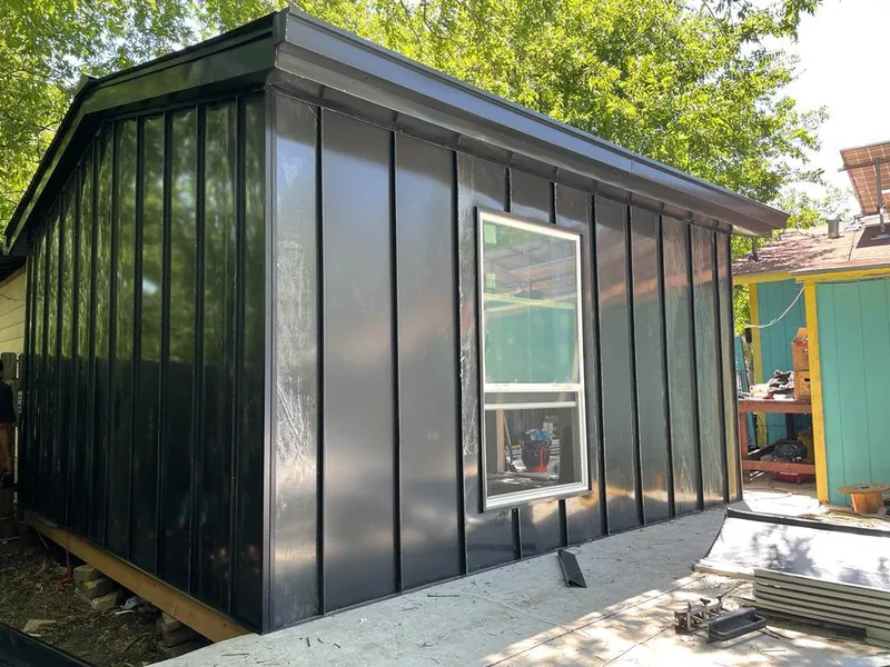 Black standing seam metal wall panels for Roof Inspection in Doolittle